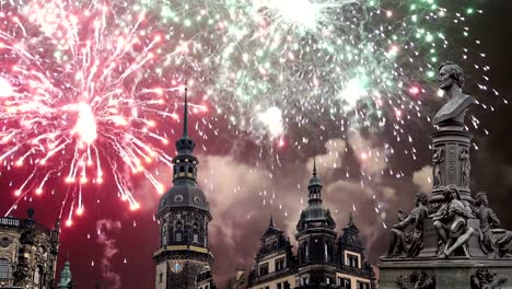 Sculpture-on-the-Bruhl-Terrace-and--Hofkirche-or-Cathedral-of-Holy-Trinity-and-holiday-fireworks---baroque-church-in-Dresden,-Sachsen,-Germany