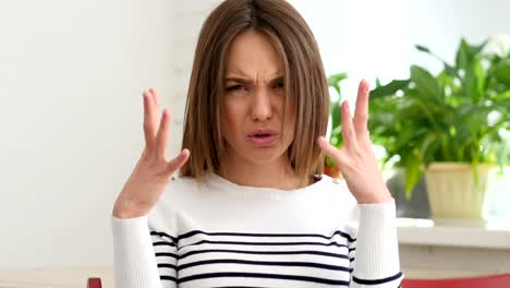 Beautiful-Young-Woman-Gesturing-Frustration-and-Anger