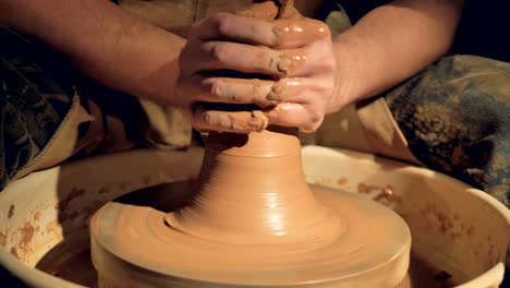 A-close-view-on-potters-hands-throwing-a-vase.