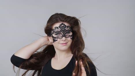 Woman-with-carnival-mask-long-hair-blowing