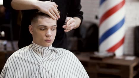 Young-caucasian-guy-in-barbershop