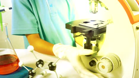 Cute-child-boy-study-science-in-laboratory-in-classroom