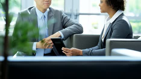 Young-multi-ethnic-finance-team-using-tablet-technology