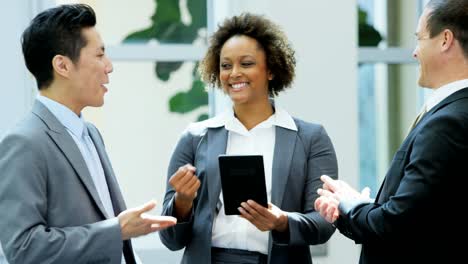 Young-multi-ethnic-finance-team-using-wifi-tablet