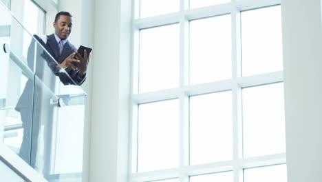 African-American-male-finance-executive-using-tablet-device