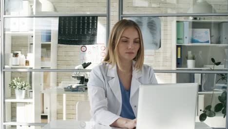 Caucasian-Doctor-Typing-on-Computer-in-Clinic