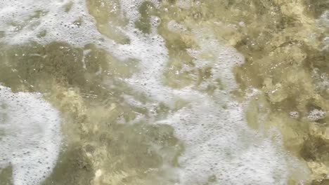 slow-motion-of-waves-breaking-at-the-shoreline-of-Pedn-Vounder-Beach,-Cornwall