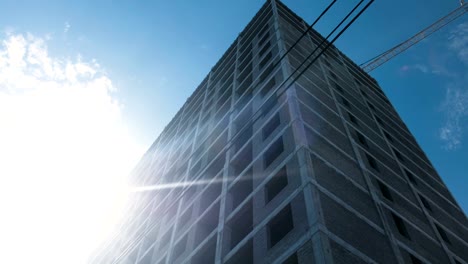 Multi-storey-under-construction-building-and-construction-crane-on-clear-sky-background.