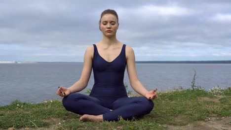 Woman-in-classical-yoga-pose,-energy-concentration