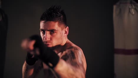 Motivated-male-boxer-training-hits