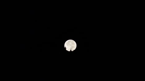 Super-Moon-set-behind-Wat-Phra-that-Doi-Suthep-Temple,-Chiang-Mai,-Thailand