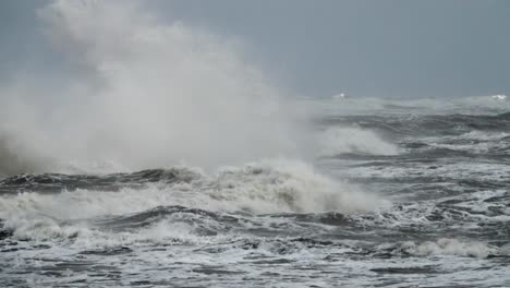 High-wave-breaking-on-the-rocks-of-the-coastline.-Extremely-Big-Wave-crushing-coast-,-Large-Ocean-Beautiful-Wave.-Super-Slow-Motion.