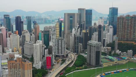 día-tiempo-paisaje-urbano-centro-wan-chai-distrito-aéreo-panorama-4k-hong-kong