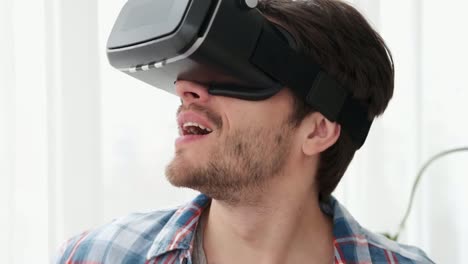 Man-doing-hand-gesture-wearing-vr-glasses