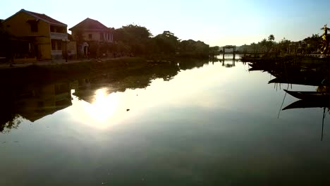 motion-along-channel-past-boats-houses-to-bridge