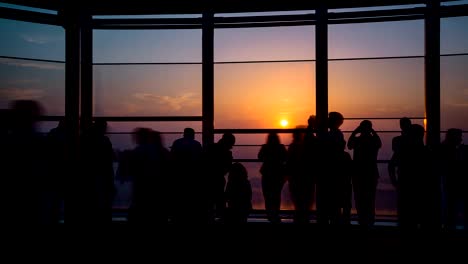 People-walking-and-make-photo-on-roof-top-observation-desk-,-time-lapse