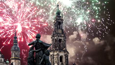 Sculpture-on-the-Bruhl-Terrace-and--Hofkirche-or-Cathedral-of-Holy-Trinity-and-holiday-fireworks---baroque-church-in-Dresden,-Sachsen,-Germany