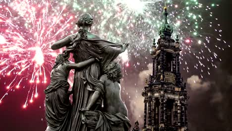 Sculpture-on-the-Bruhl-Terrace-and--Hofkirche-or-Cathedral-of-Holy-Trinity-and-holiday-fireworks---baroque-church-in-Dresden,-Sachsen,-Germany