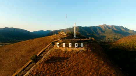 Sign-of-the-city-of-Coron-on-the-hill.Cross-on-a-hill,-Coron,-Philippines,Palawan-Busuanga