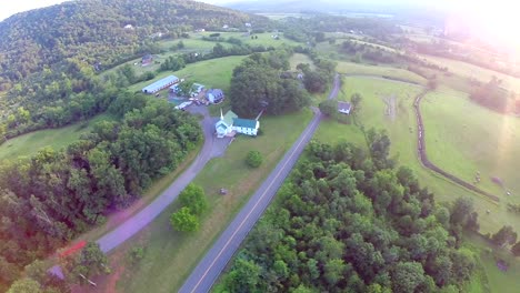 sunset-aerial-flyover-of-church-with-lens-flare