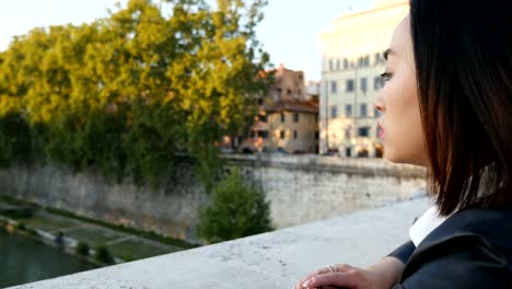 Sad-and-lonely-Chinese-tourist-contemplates-the-river,close-up