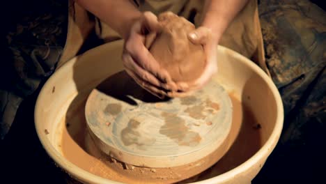 A-potter-brings-together-two-lumps-of-clay.