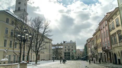 LVOV,-UKRAINE---Winter-2018-Timelapse:-Center-of-old-city-Lviv,-Ukraine.-Time-lapse-of-moving-people-through-the-Market-Square-(Ploshcha-Rynok)-near-City-Hall.-Clouds-are-moving-quickly.