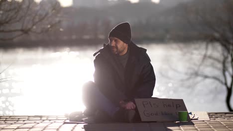 Mature-beggar-asking-for-money-help-on-street