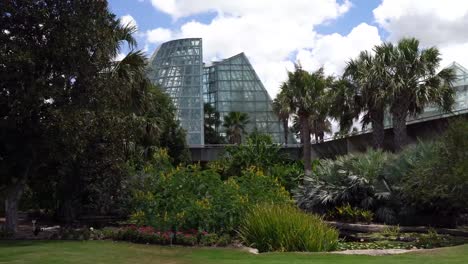 Low-Angle-Panning-and-Moving-Across-Video-of-Cone-Shape-Glass-Greenhouse