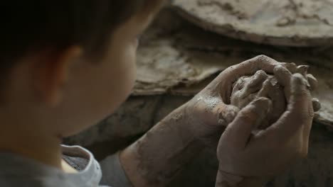Boy-Playing-with-Clay-in-Arts-and-Crafts-Class