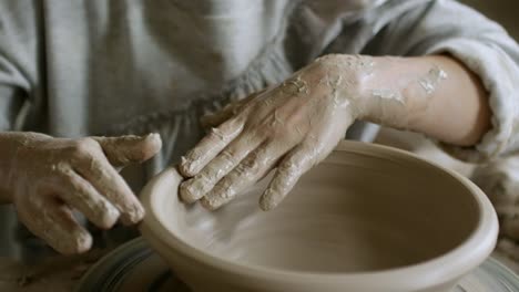 Little-Girl-Learning-to-Make-Pottery