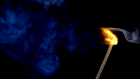 Burning-match-on-a-black-background-in-slow-motion