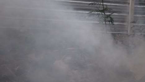 Gray-and-black-color-smoke-from-burning-sticks