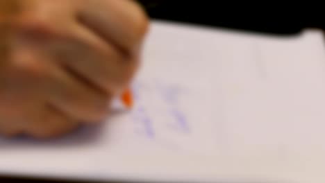 Female-Writes-Note-With-Pen-Fast-Blur