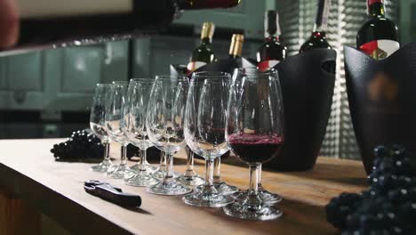 Pouring-wine-into-wineglasses-for-degustation