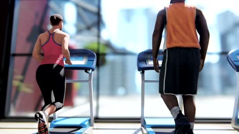 Gym-with-various-exercise-machines-in-it-and-people-walking-on-treadmill-at-sunny-day