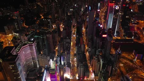 night-time-illuminated-hong-kong-cityscape-downtown-traffic-street-topdown-aerial-panorama-4k