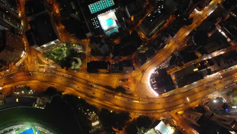 noche-iluminada-ciudad-de-hong-kong-centro-tráfico-arriba-abajo-calle-panorama-aéreo-4k