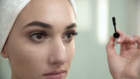 Makeup-At-Bathroom.-Woman-Applying-Mascara-On-Eyelashes