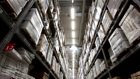 Moving-between-cardboard-boxes-and-different-materials-in-a-storage-warehouse