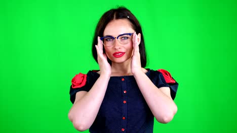 green-background,-chromeakey.-portrait-of-a-sexy-brunette-woman-with-red-lips,-in-stylish-glasses,-spectacles,-eroticly,-playfully-moves,-looking-sexually-at-camera,-posing-in-studio