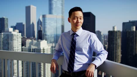 Portrait-of-Asian-business-executive-on-Chicago-rooftop