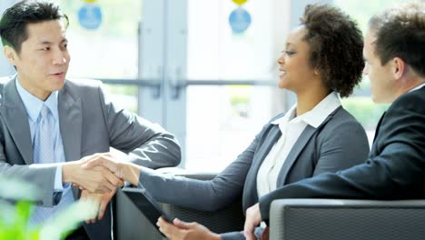 Multi-ethnic-male-female-business-people-in-meeting