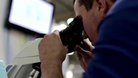 Doctor-in-the-laboratory-works-with-a-microscope