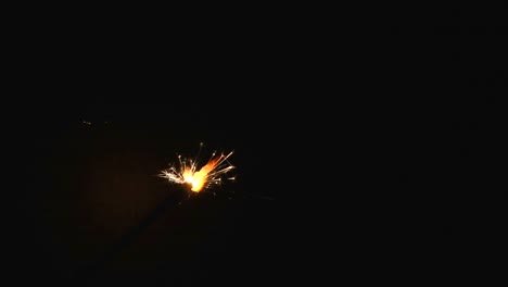 burning-sparkler-floating-in-the-air-on-black-background