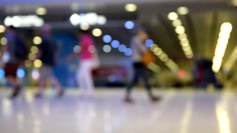 Travelers-passengers-in-Suvarnabhumi-airport-terminal,-out-of-focus-and-blurry