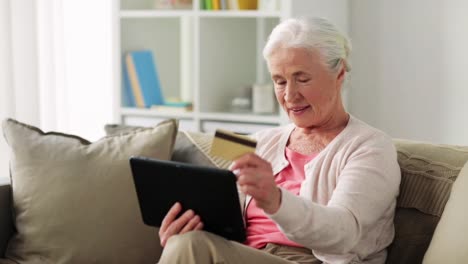 senior-woman-with-tablet-pc-and-credit-card