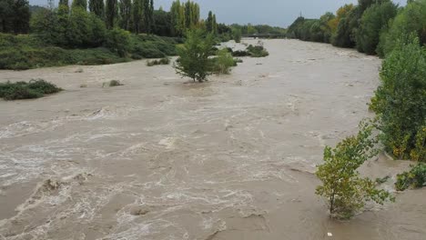 The-Serio-river-swollen-after-heavy-rains.-Province-of-Bergamo,-northern-Italy