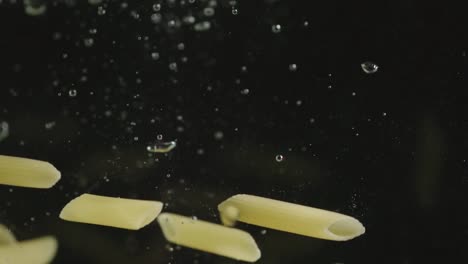 SLOW-MOTION:-Pasta-falls-under-water