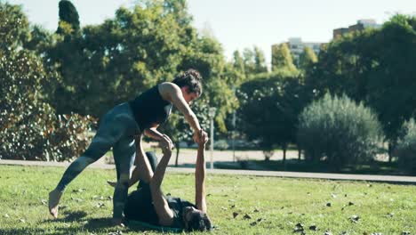 Beautiful-couple-practicing-acro-yoga-in-the-morning